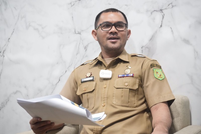 Kepala Bagian Pengadaan Barang Jasa/Unit Kerja Pengadaan Barang Jasa Kota Medan, Alexander Sinulingga Menyampaikan Data Tahun 2022 Nilai Transaksi UMKM Produk Makanan dan Minuman di Katalog Elektronik Lokal Medan,  di Ruang Kerjanya, Selasa (7/2)