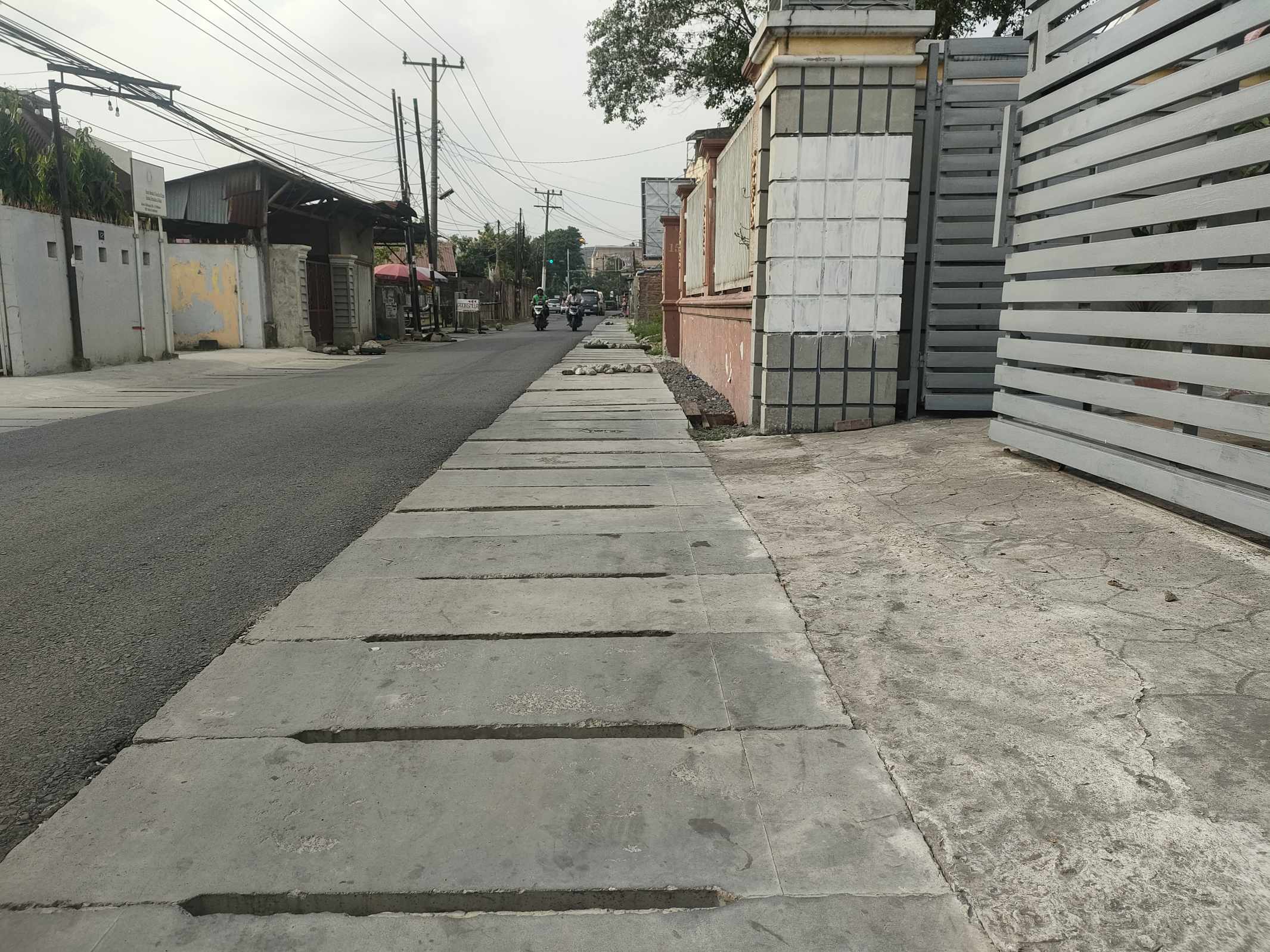 Perbaikan Saluran Drainase dan Pengaspalan Jalan Bahagia Telah Selesai, Warga Mengaku Puas dan Merasakan Manfaatnya