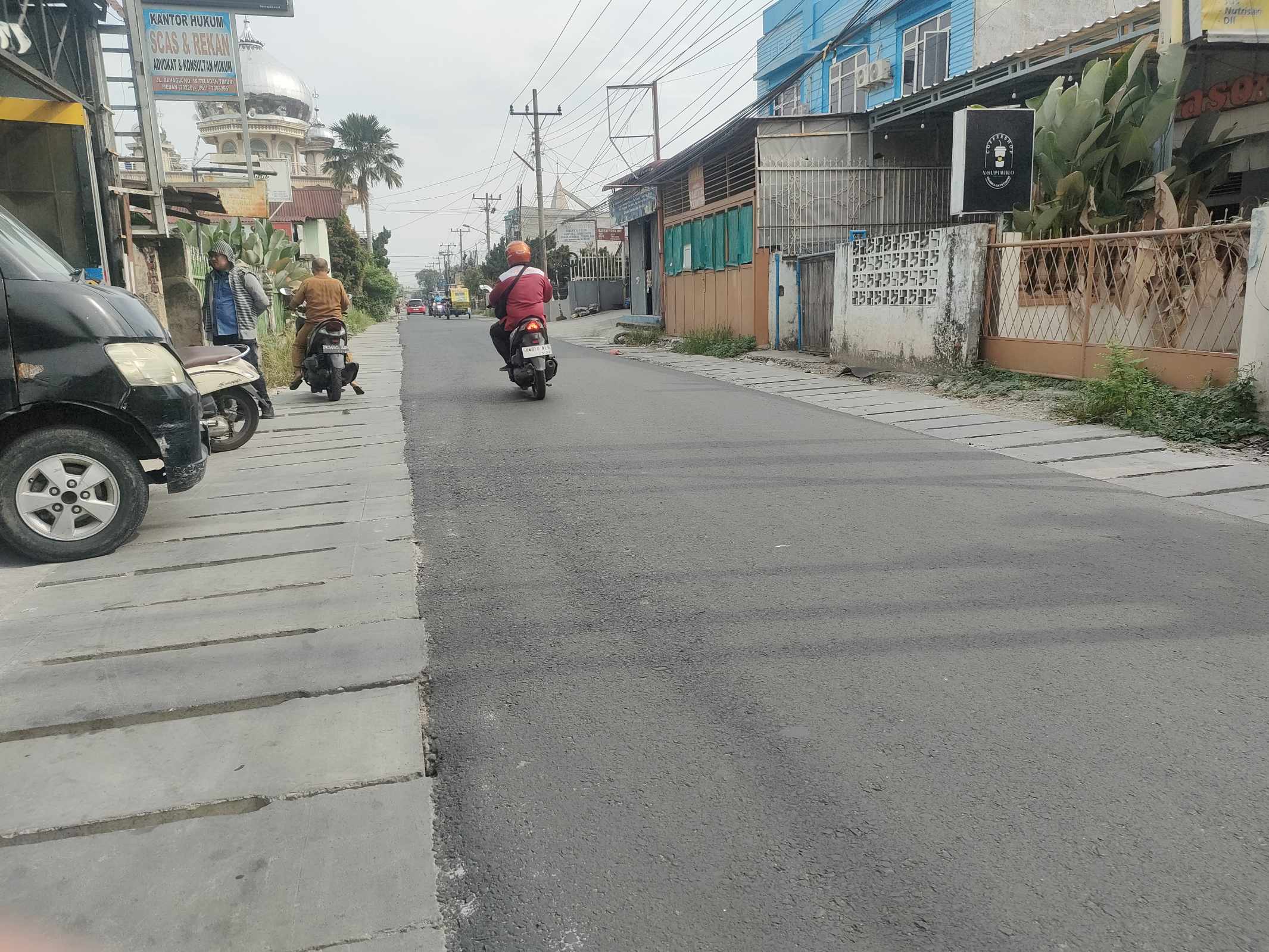 Perbaikan Saluran Drainase dan Pengaspalan Jalan Bahagia Telah Selesai, Warga Mengaku Puas dan Merasakan Manfaatnya